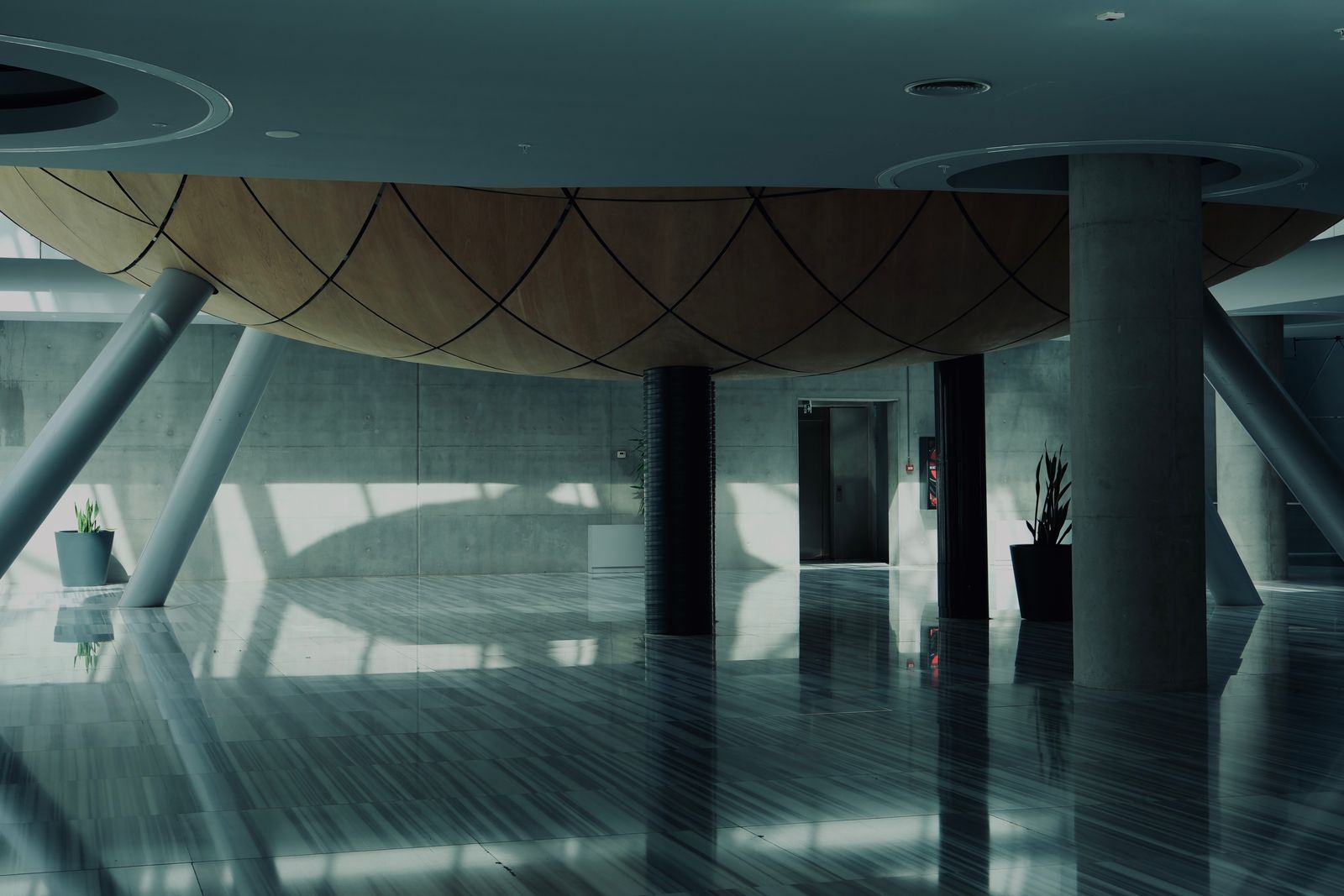 Reflective coated lobby floor mirroring the ceiling above