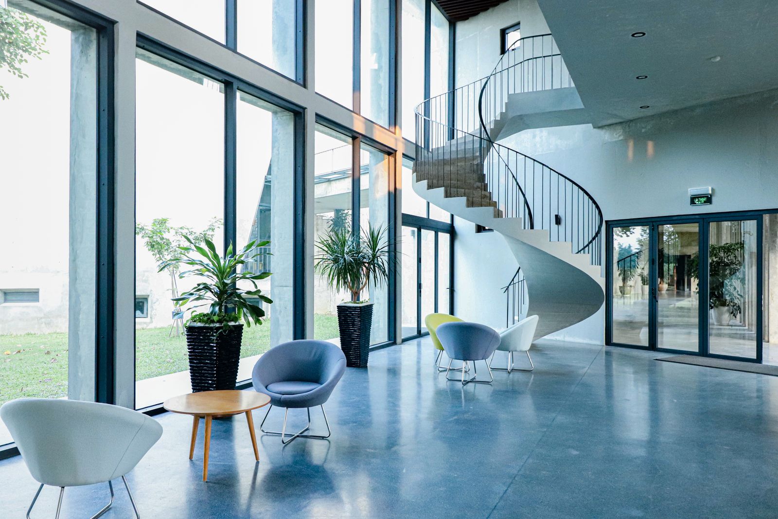 Polished floor running through a bright modern lobby